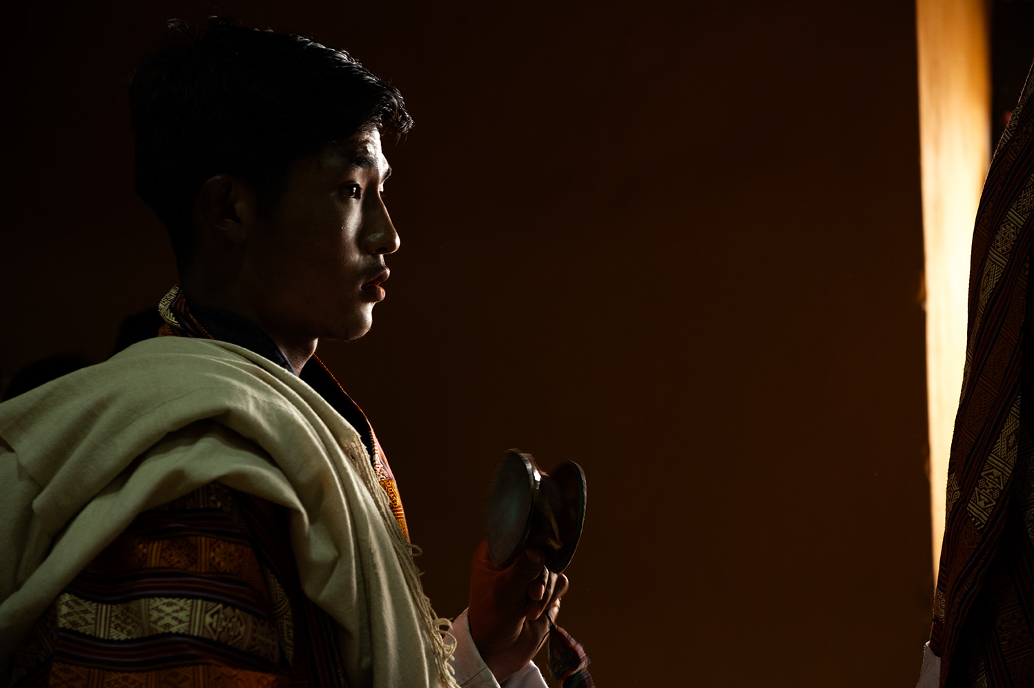 Ngawang Rai cultural photography of the Bhutan Paro Tshechu's backstage where volunteers were preparing.